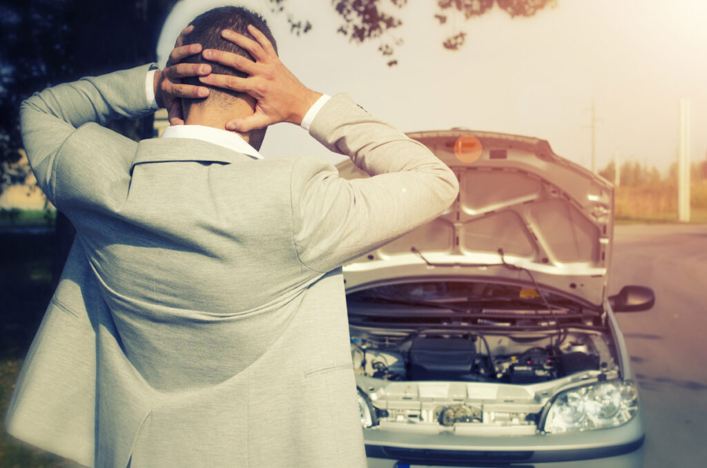 Man hands on head secure car storage 